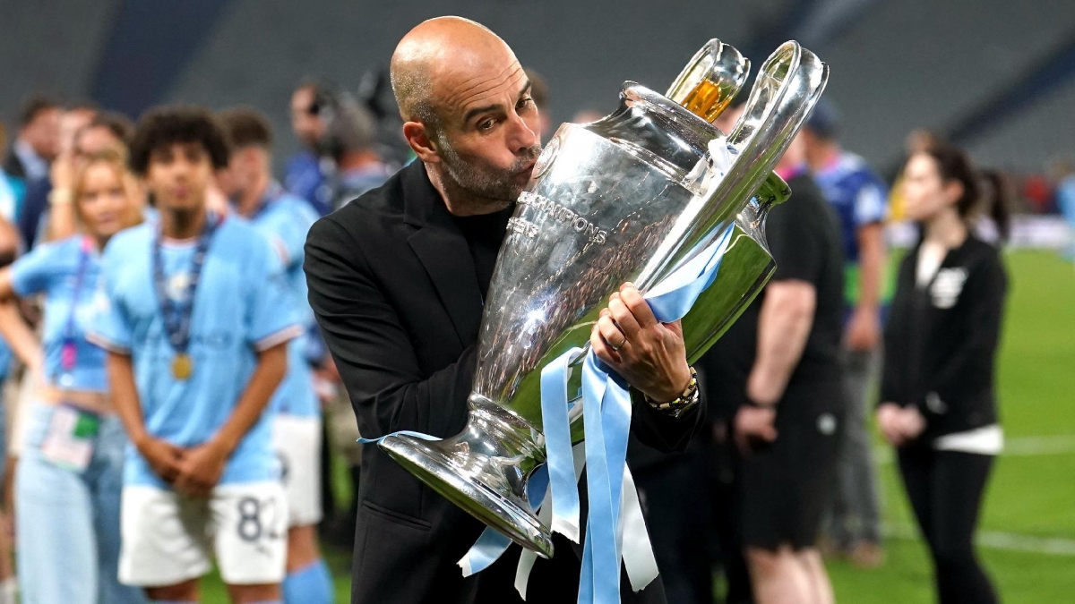 Pep Guardiola kisses the Champions League trophy