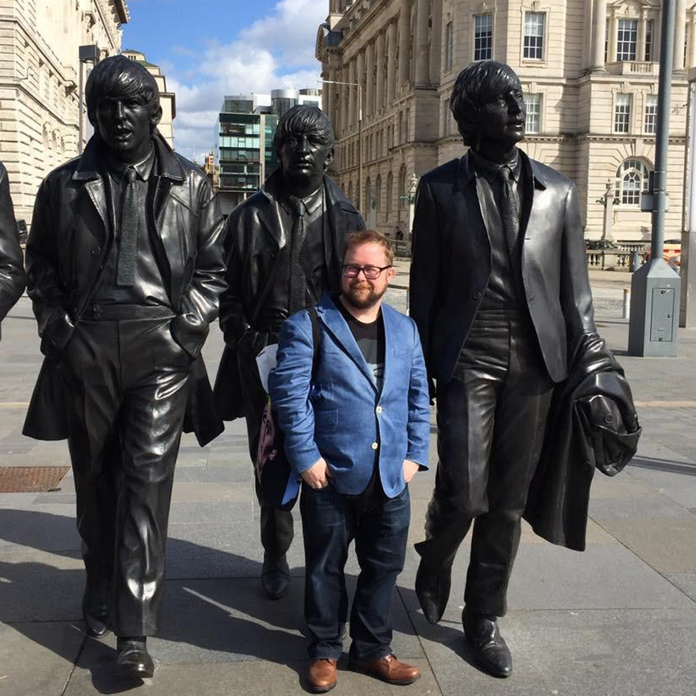 Allan in front of a (slightly larger than life) statue of the Beatles
