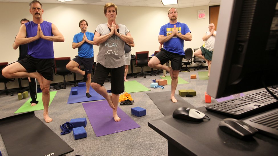 কর্মক্ষেত্রে যোগ ব্যায়ামের প্রশিক্ষণ চলছে